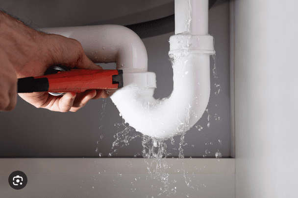 handyman working on plumbing repairs in Somerset West